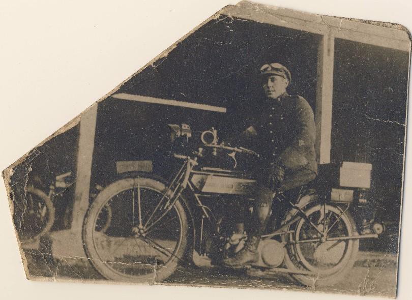 Despatch rider Nelson Farrell on his Triumph Motorcycle ca.1918. Note the (blue and white) armband on his right arm.